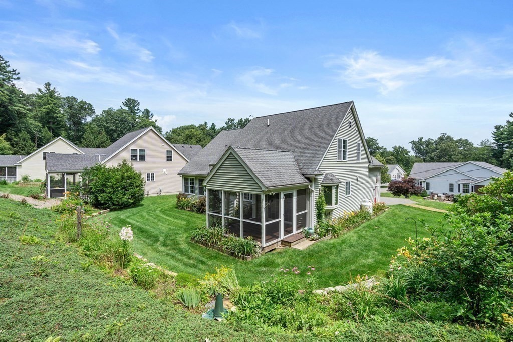 8 Reed Lane, Unit 8 Littleton, MA 01460 - Photo 33 of 37 a view of a house with a big yard plants and large trees
