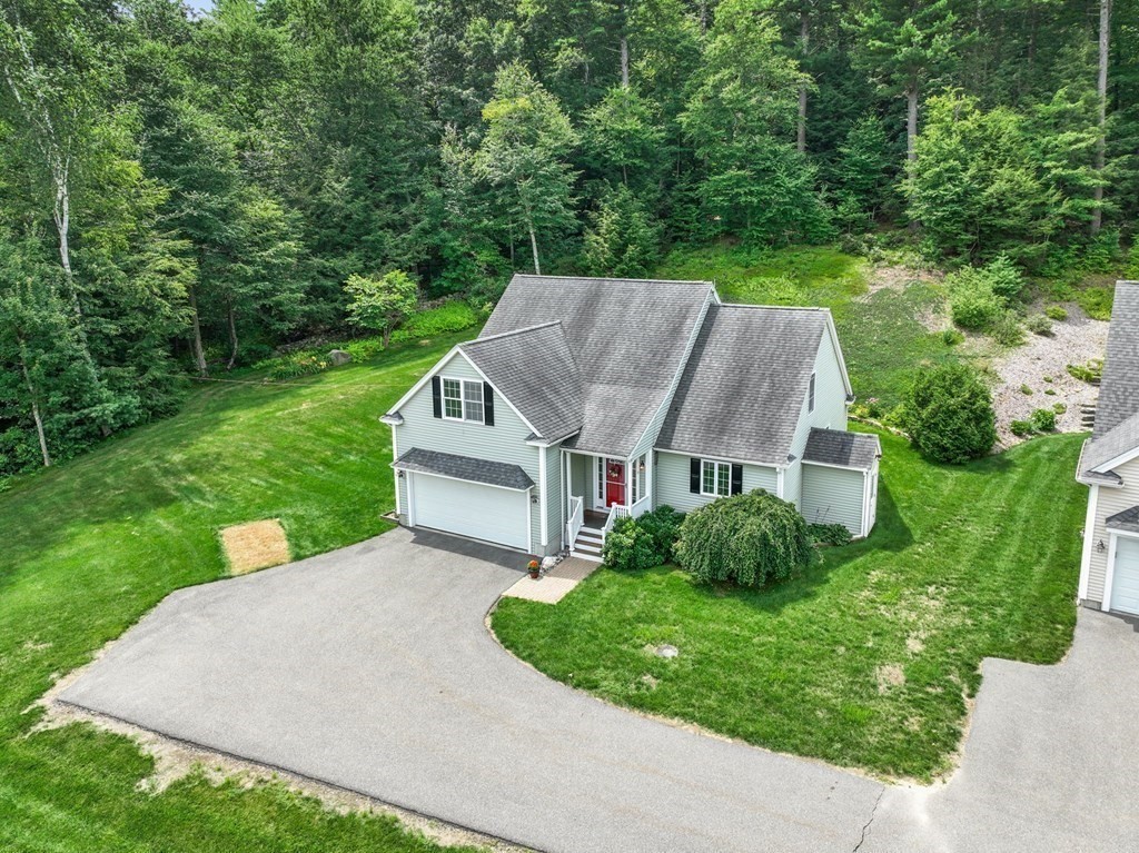 8 Reed Lane, Unit 8 Littleton, MA 01460 - Photo 35 of 37 a aerial view of a house next to a big yard and large trees