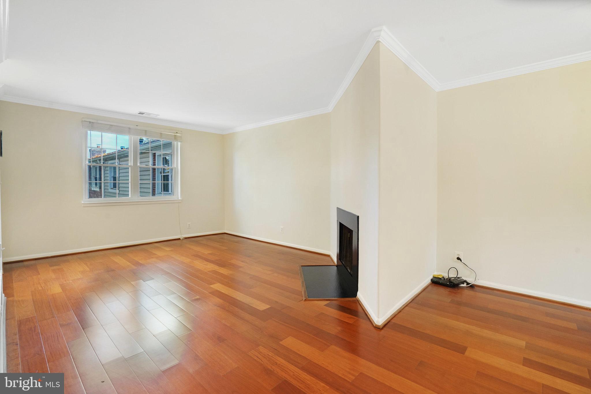 4614 28th Road South, Unit B Arlington, VA 22206 - Photo 14 of 27 an empty room with wooden floor and windows