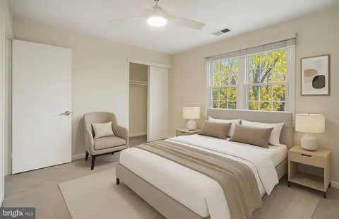 a bedroom with a bed and a couch