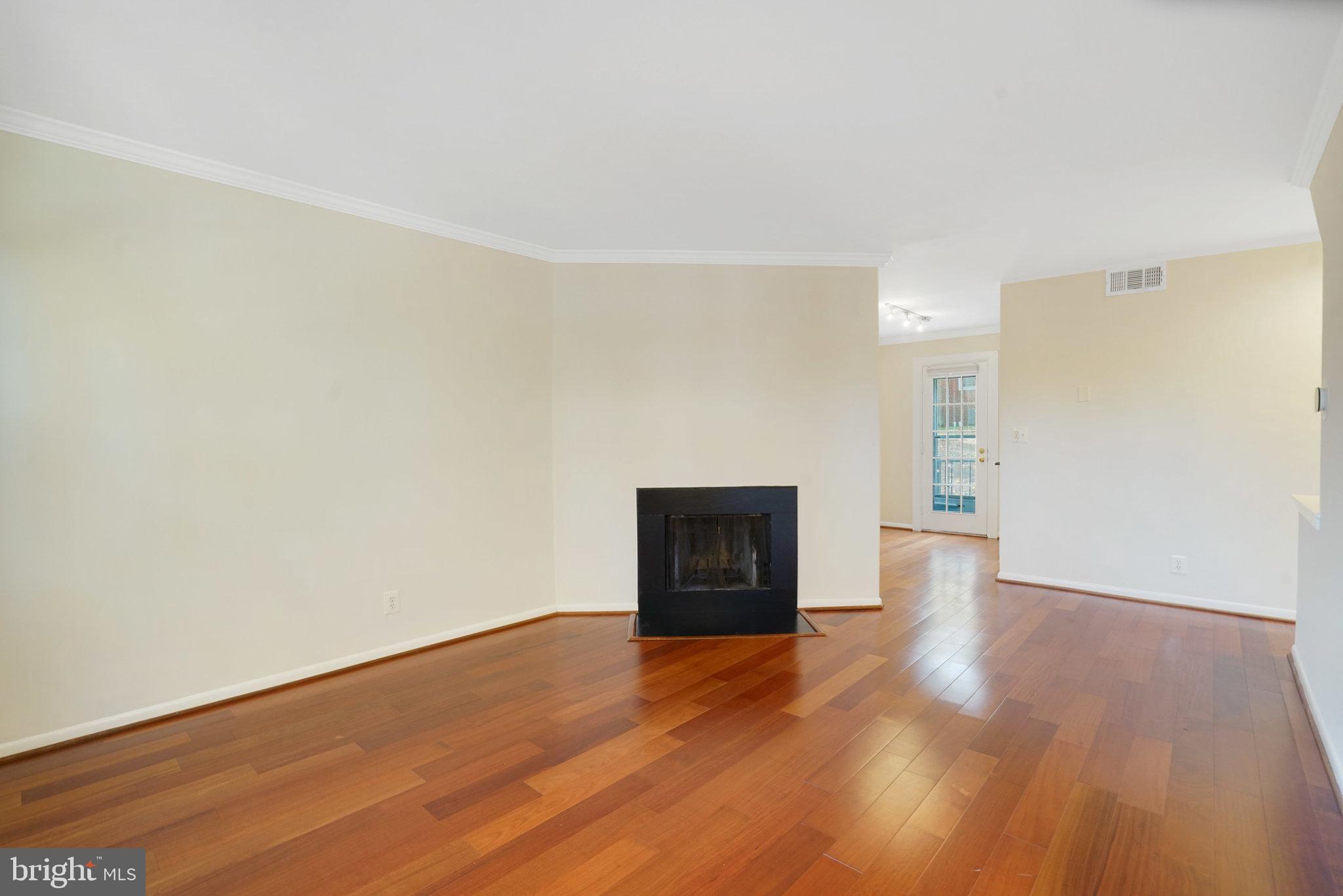 4614 28th Road South, Unit B Arlington, VA 22206 - Photo 6 of 27 a view of an empty room with wooden floor