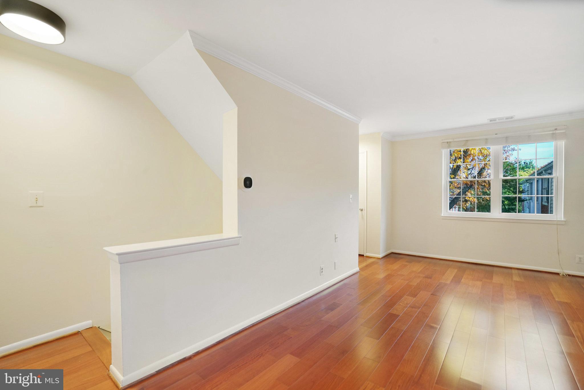4614 28th Road South, Unit B Arlington, VA 22206 - Photo 9 of 27 an empty room with wooden floor and windows