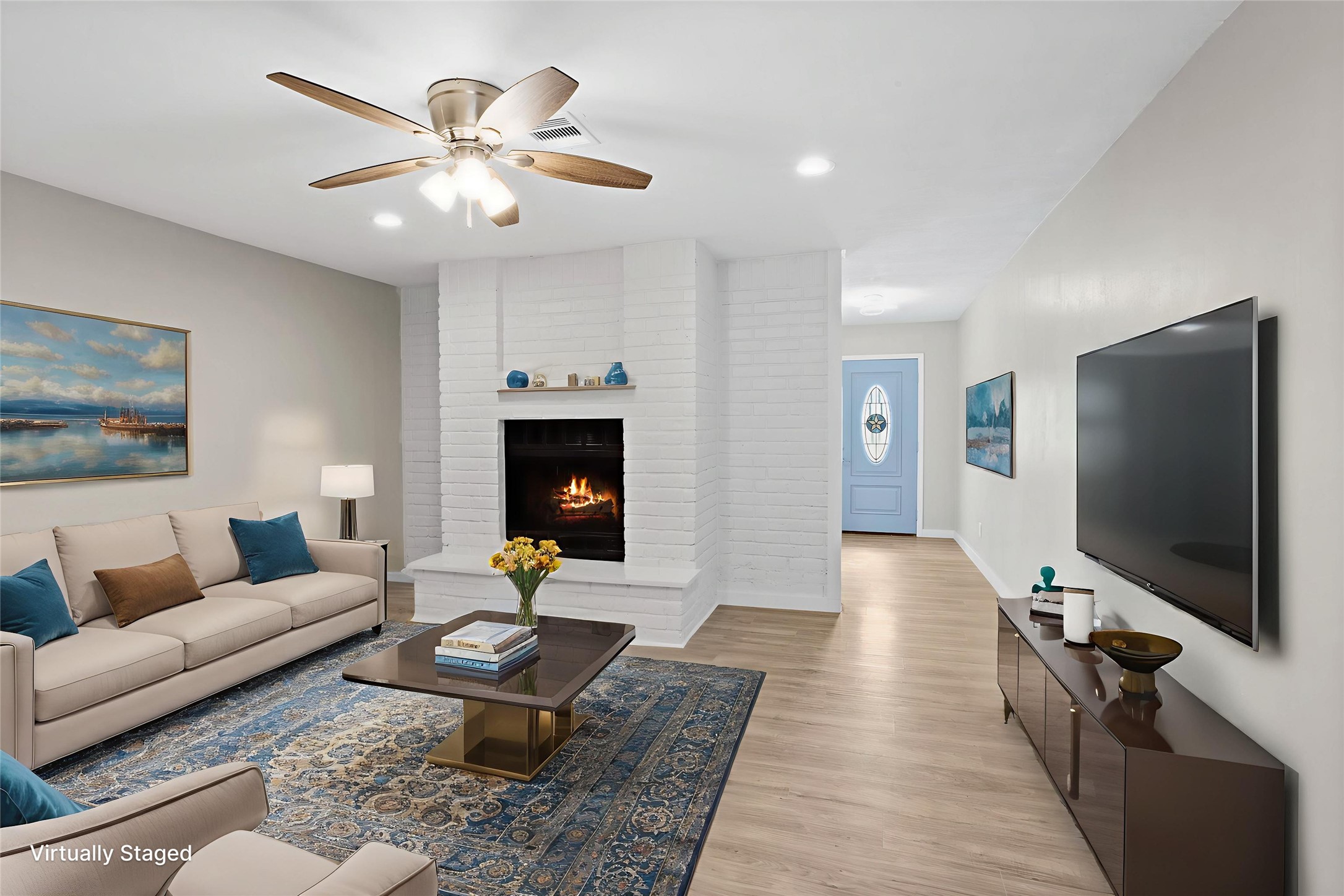 10127 Tolman Street Houston, TX 77034 - Photo 6 of 30 a living room with furniture and a flat screen tv