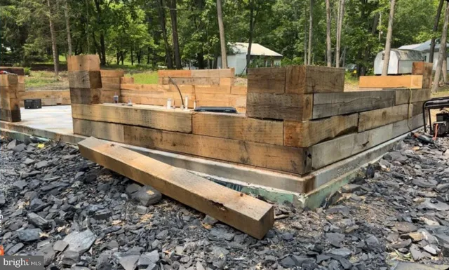 a view of a backyard with trees