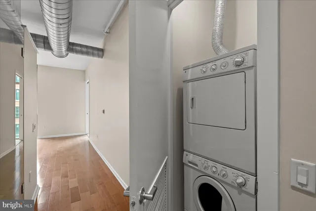 a view of a hallway with washer and dryer