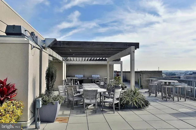 a view of dinning table and chairs in patio