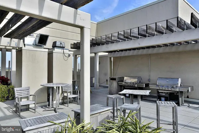 a outdoor space with lots of chairs and mirrors