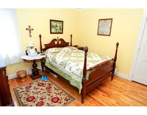 32 Ellis Road Westminster, MA 01473 - Photo 25 of 42 a bed sitting in a bedroom next to a window with wooden floor