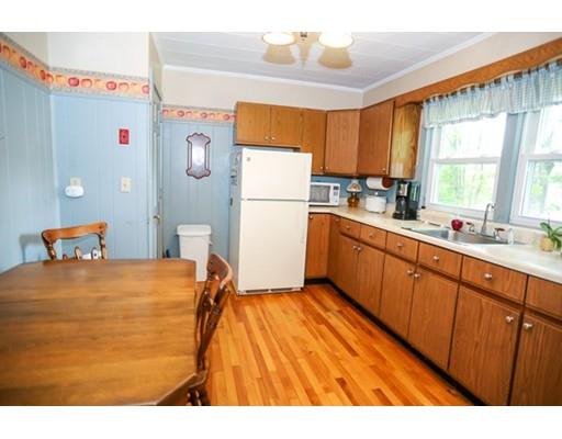 32 Ellis Road Westminster, MA 01473 - Photo 30 of 42 a kitchen with stainless steel appliances granite countertop a refrigerator a sink dishwasher a stove and white countertops with wooden floor