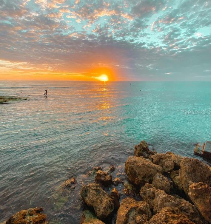 7006 Midnight Pass Road, Unit 1 Sarasota, FL 34242 - Photo 2 of 12 a view of an ocean and beach
