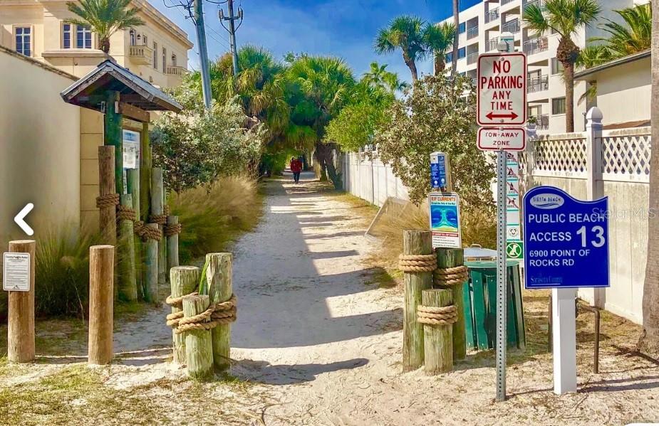 7006 Midnight Pass Road, Unit 1 Sarasota, FL 34242 - Photo 3 of 12 a front view of a building with street sign