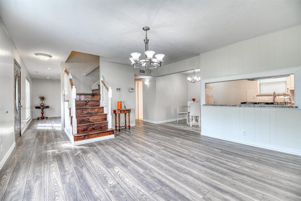 a view of a livingroom with wooden floor