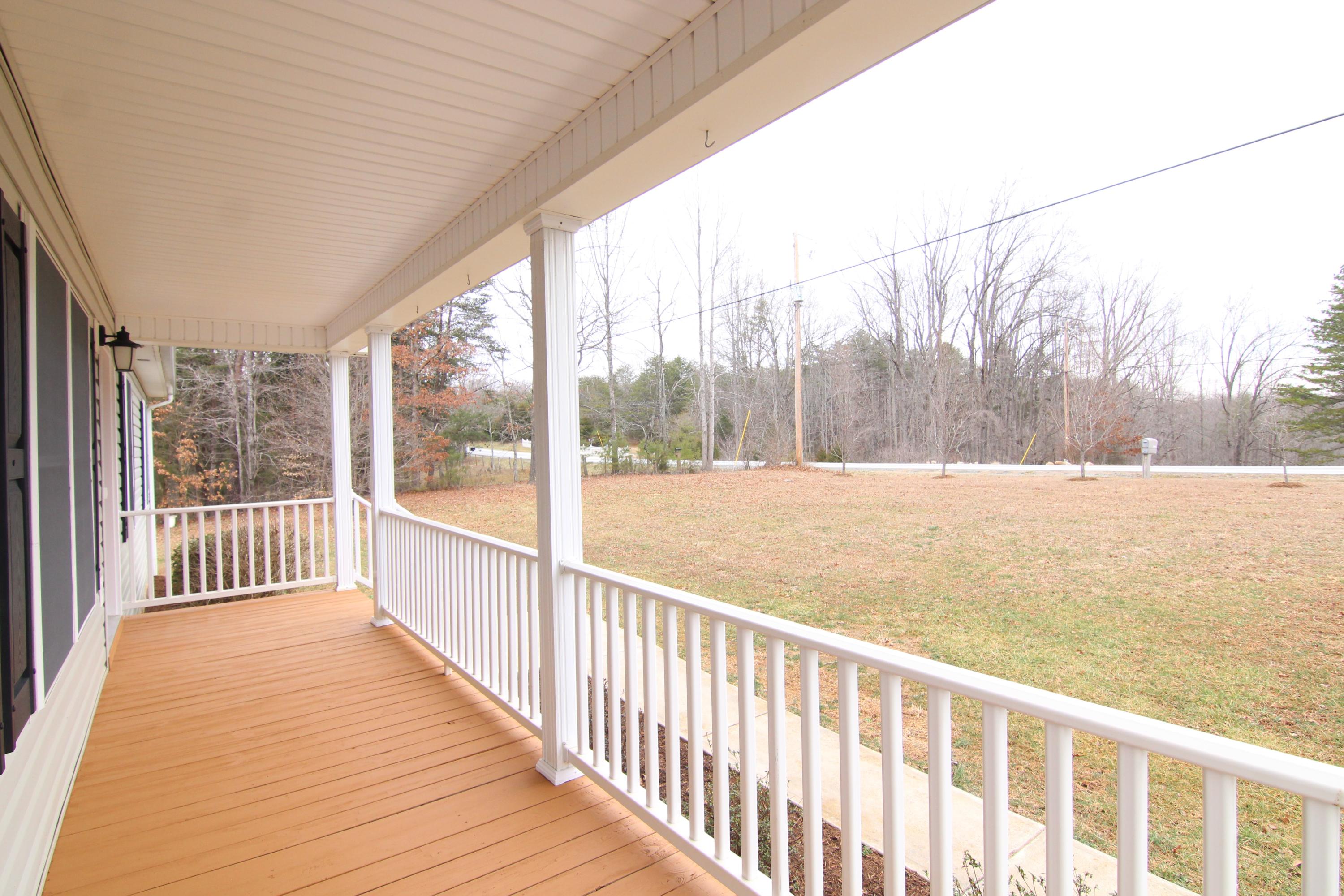 5949 Hardy Road Hardy, VA 24101 - Photo 5 of 38 a view of balcony with wooden floor and fence