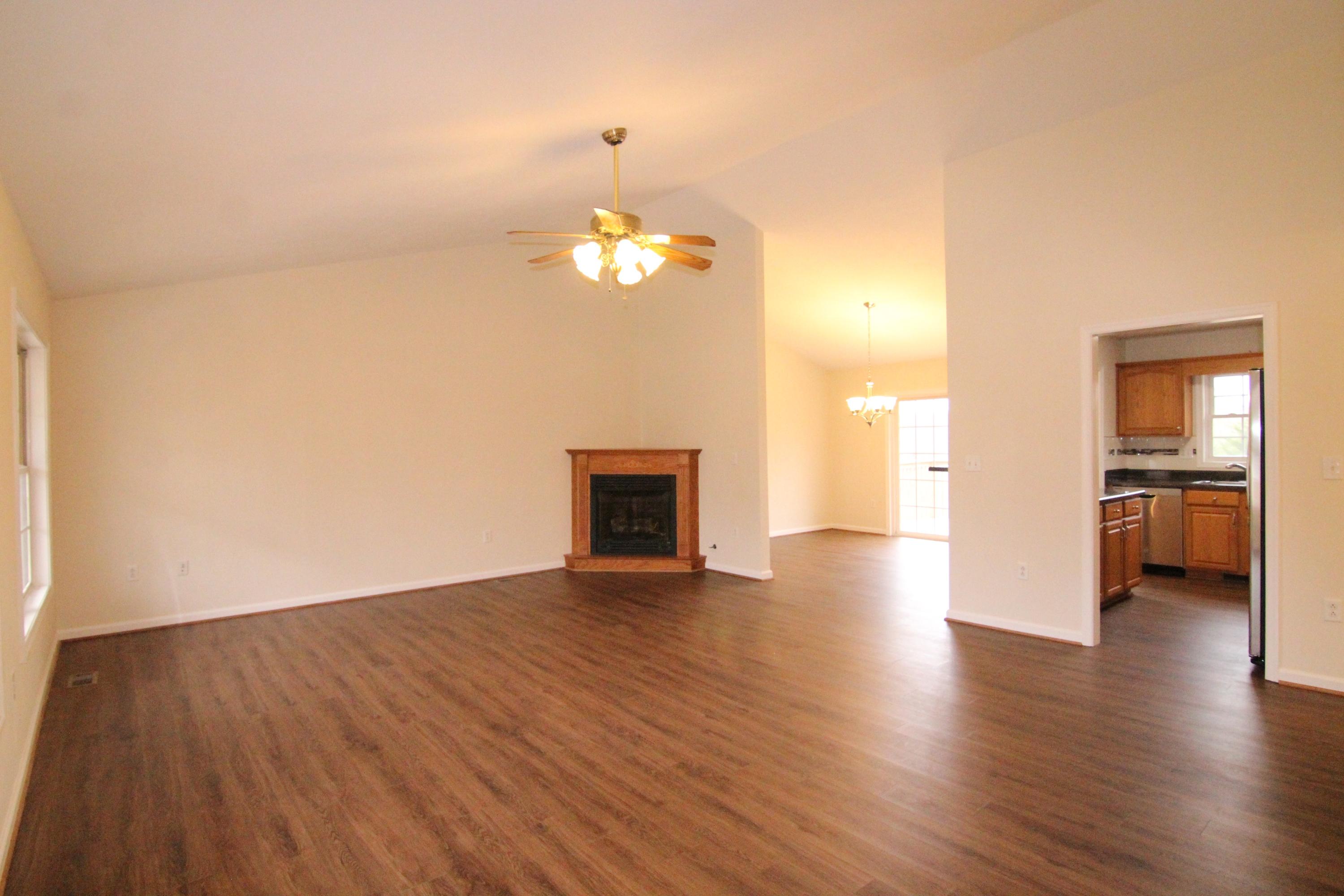 5949 Hardy Road Hardy, VA 24101 - Photo 6 of 38 a view of a livingroom with wooden floor and a kitchen