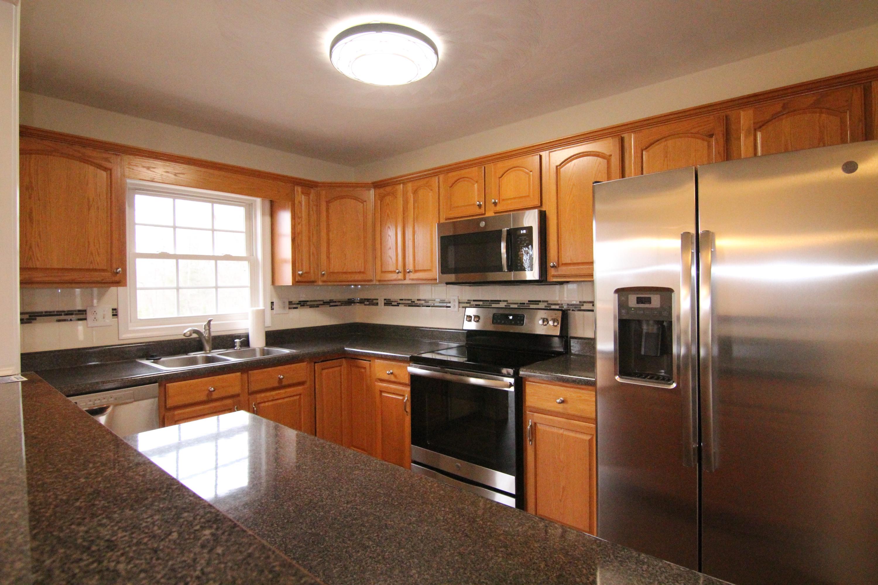 5949 Hardy Road Hardy, VA 24101 - Photo 10 of 38 a kitchen with stainless steel appliances granite countertop a sink a stove and refrigerator