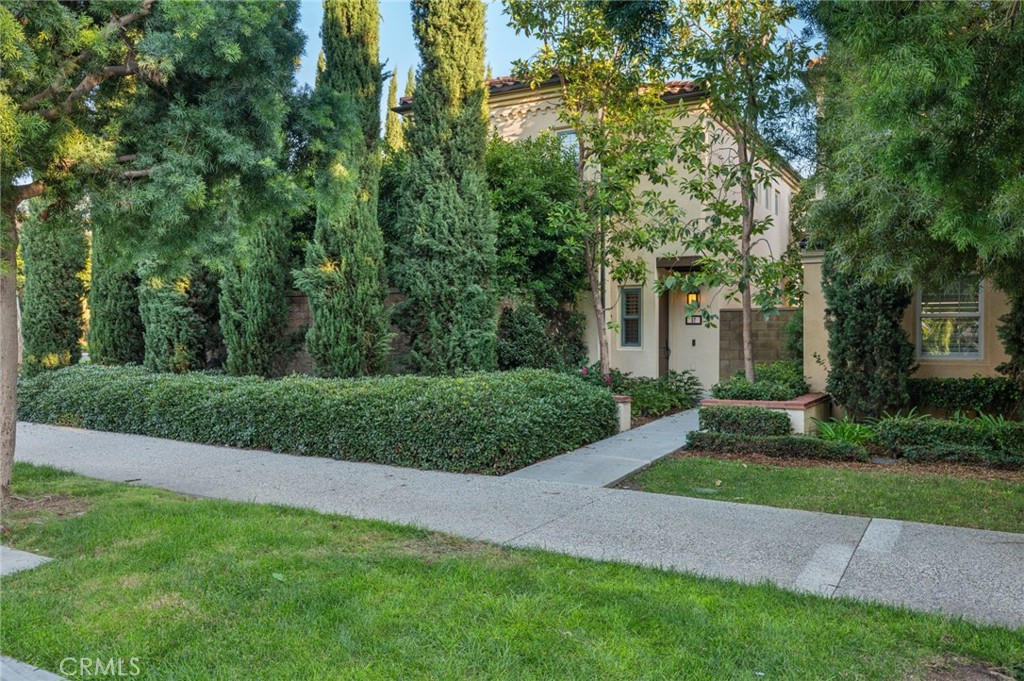 57 Strawberry Grove Irvine, CA 92620 - Photo 1 of 1 a view of a house with a tree in the park