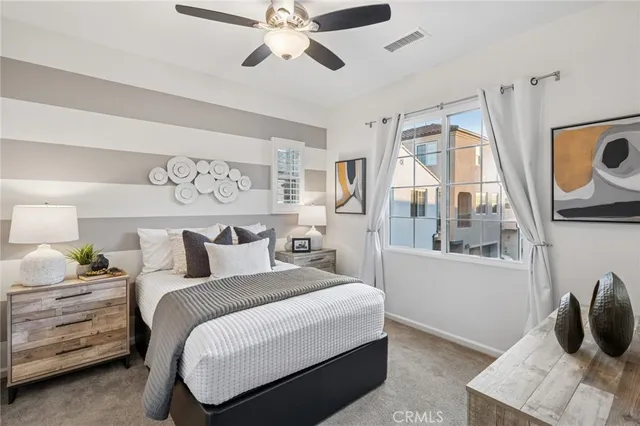 a bedroom with a bed and window