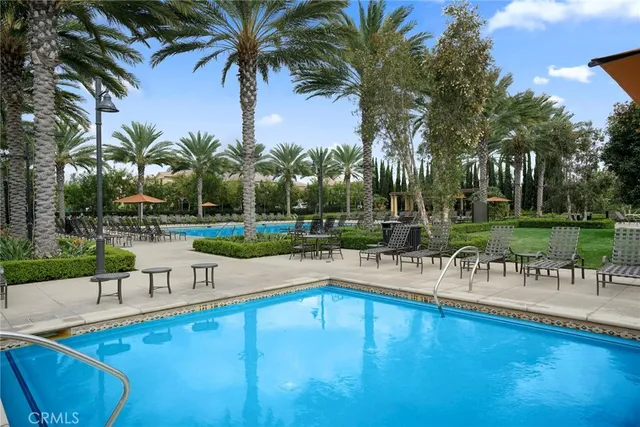 a view of a swimming pool with chairs