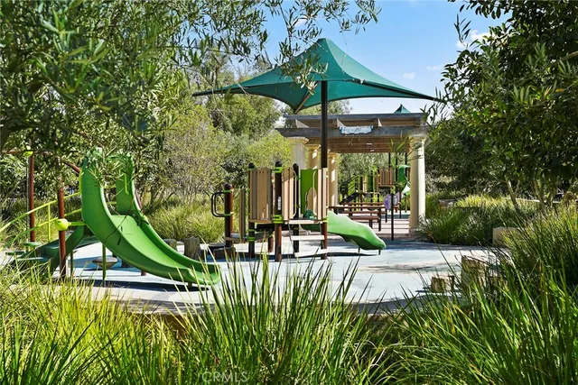 a view of a table and chairs under an umbrella