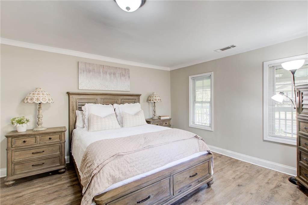 411 Ash Street Monroe, GA 30655 - Photo 22 of 36 a bedroom with a bed and a window