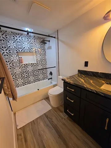 a bathroom with a bathtub and shower