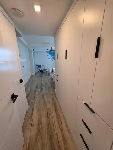 a bedroom with two beds and painted walls