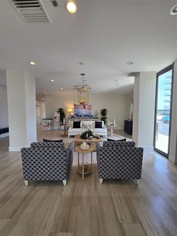 a view of a balcony with wooden floor and outdoor space