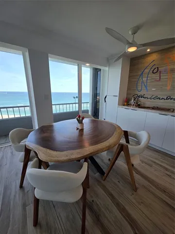 a view of a dining table and chairs in a room