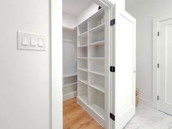 a view of a room with kitchen and fireplace