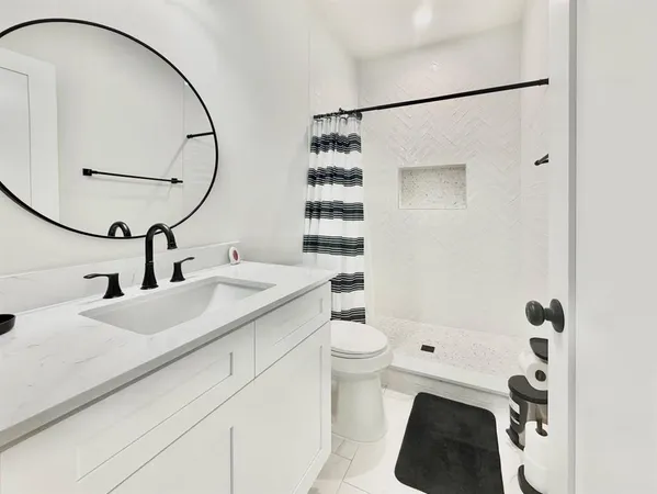 a view of a lake with a house and a big yard