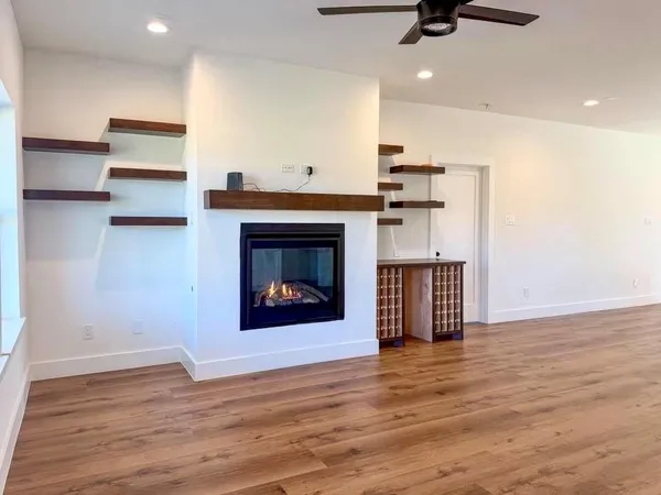 a view of an entryway with wooden floor