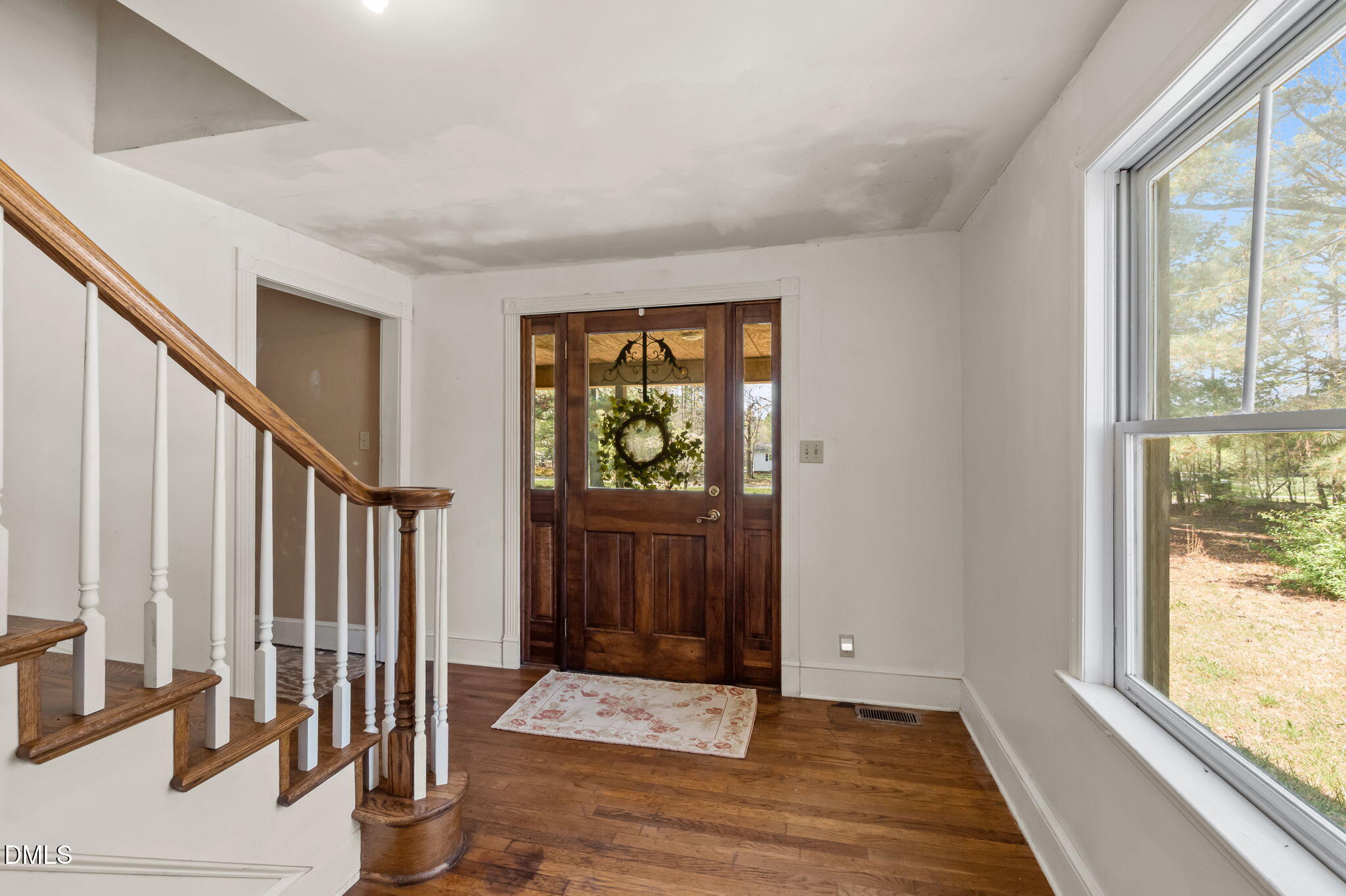 212 Thomas Humphries Road Roxboro, NC 27574 - Photo 19 of 56 an entryway with wooden floor and windows
