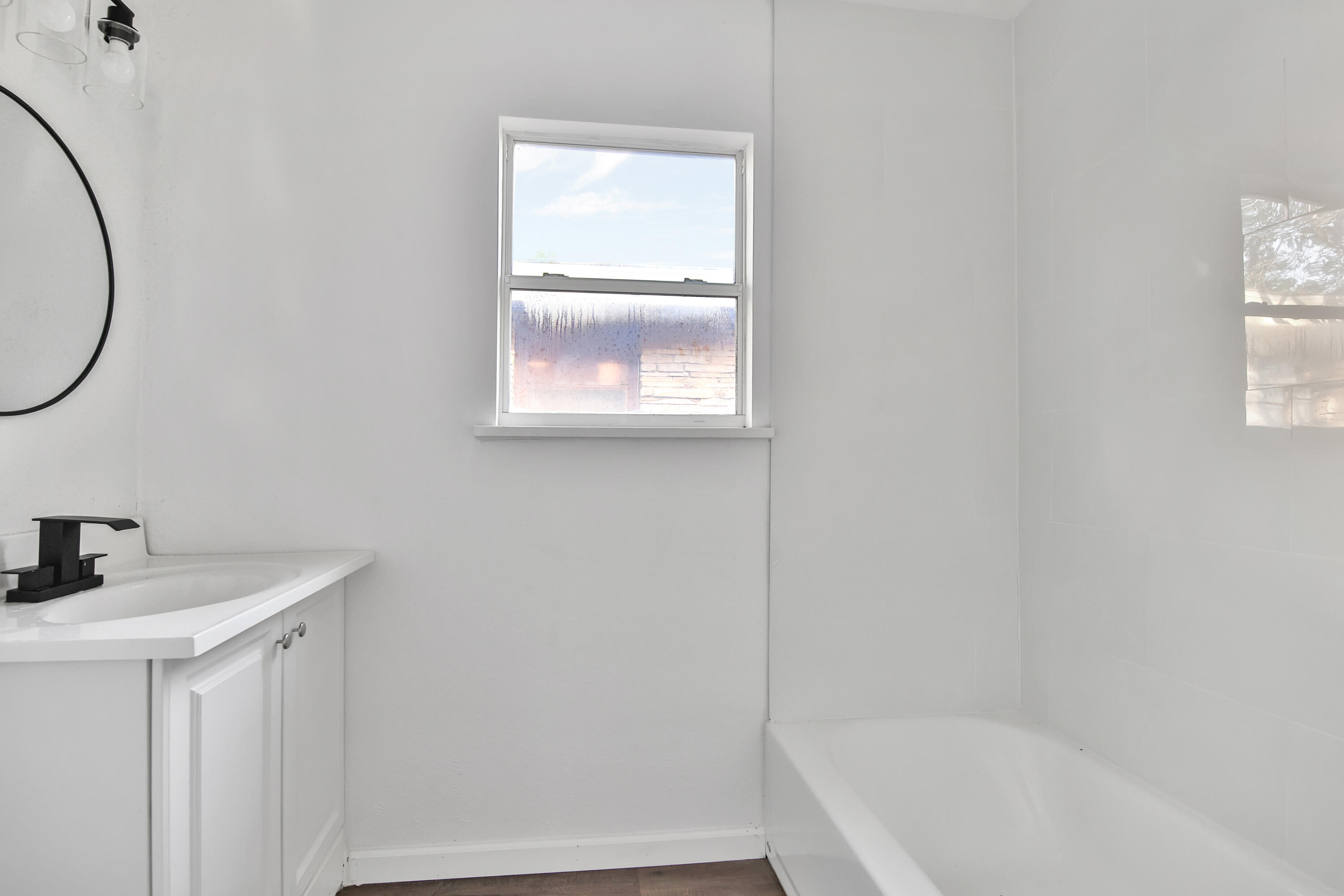 2004 31st Street Lubbock, TX 79411 - Photo 21 of 24 a bathroom with a sink and a bathtub