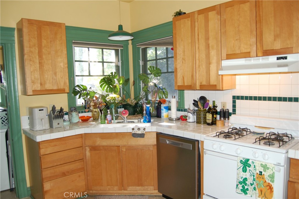 4160 Chestnut Street Riverside, CA 92501 - Photo 13 of 39 a kitchen with sink cabinets and a window
