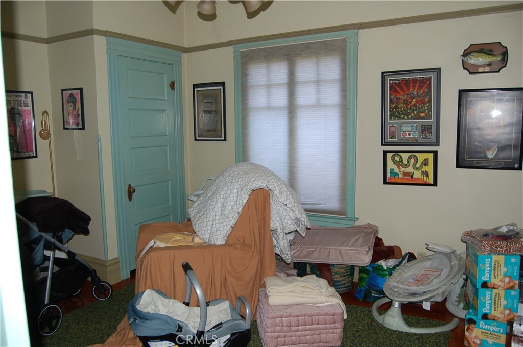 4160 Chestnut Street Riverside, CA 92501 - Photo 18 of 39 a living room with furniture and a mirror
