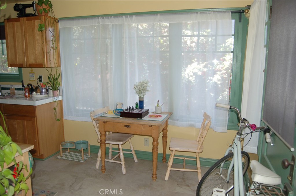 4160 Chestnut Street Riverside, CA 92501 - Photo 22 of 39 a view of a dining room with furniture and window