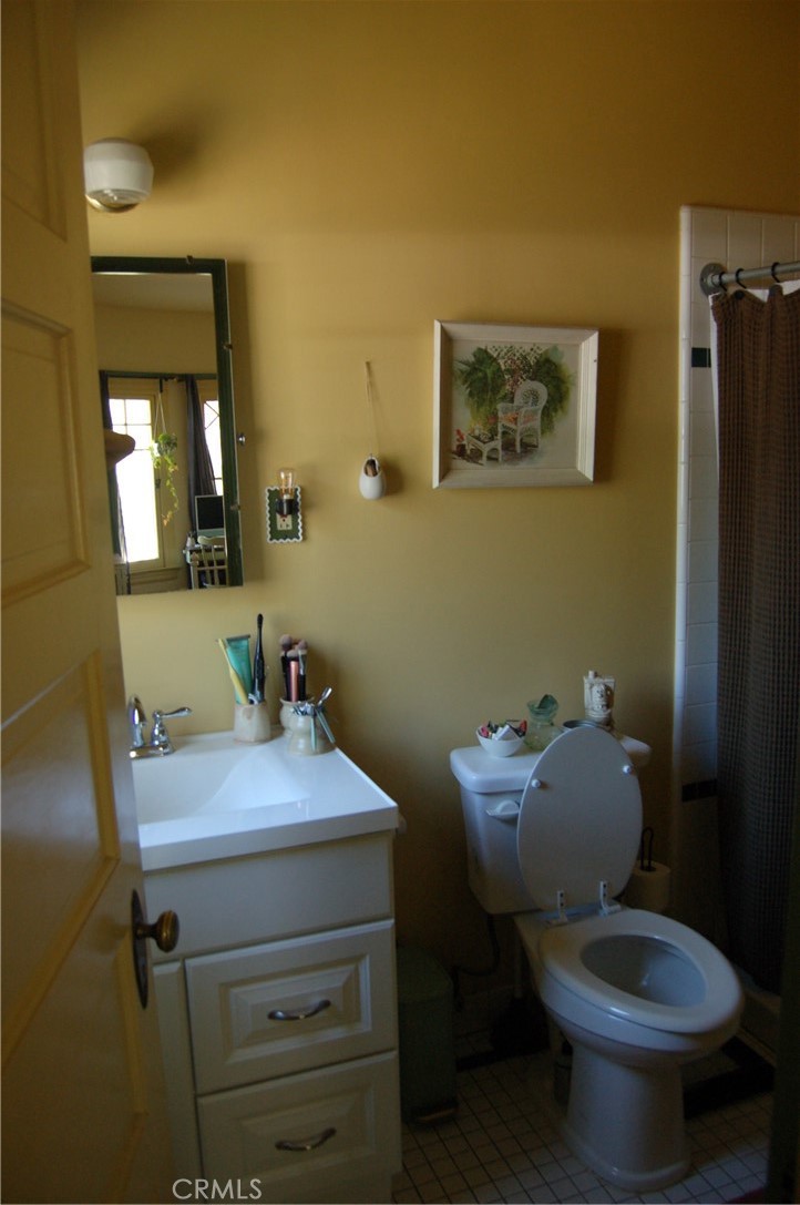 4160 Chestnut Street Riverside, CA 92501 - Photo 26 of 39 a bathroom with a sink toilet and mirror