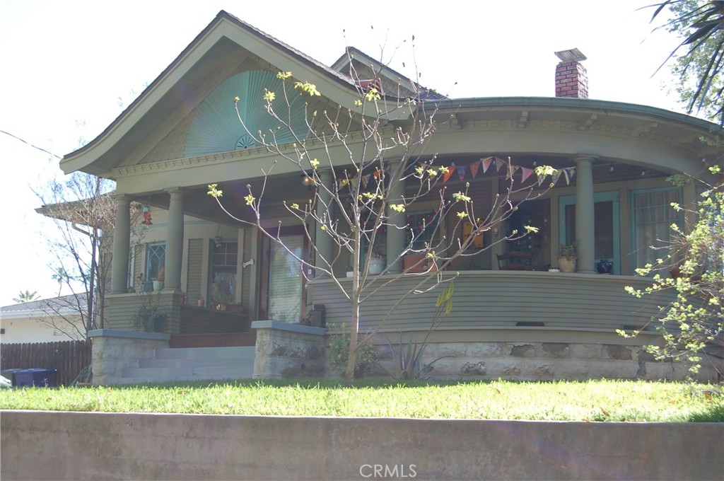 4160 Chestnut Street Riverside, CA 92501 - Photo 3 of 39 a side view of a house with a yard