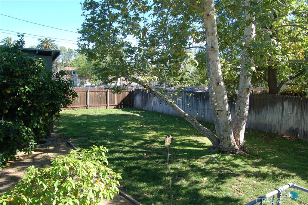4160 Chestnut Street Riverside, CA 92501 - Photo 32 of 39 a backyard of a house with lots of green space
