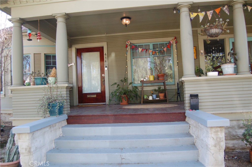 4160 Chestnut Street Riverside, CA 92501 - Photo 6 of 39 a front view of a house with a fountain