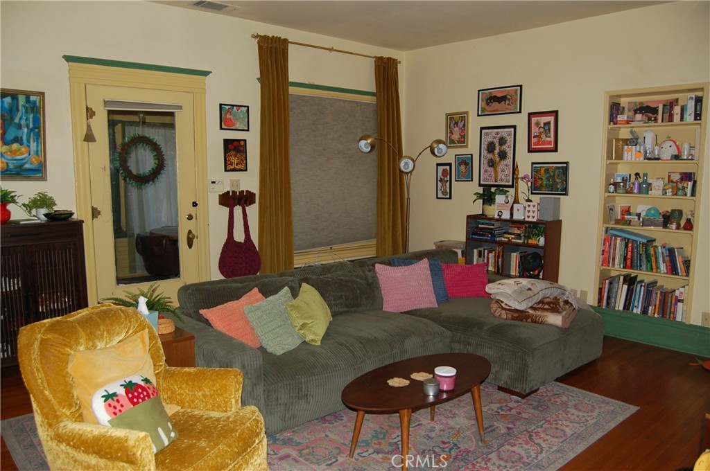 4160 Chestnut Street Riverside, CA 92501 - Photo 9 of 39 a living room with furniture and a book shelf