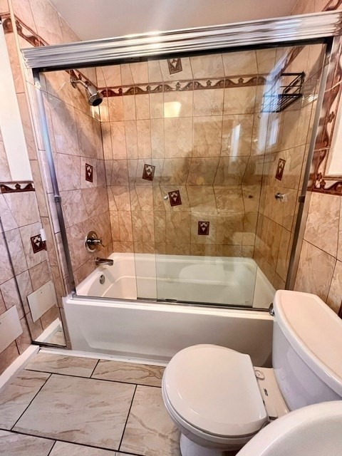 686 River Street, Unit 1 Boston, MA 02136 - Photo 4 of 11 a bathroom with a toilet and a bath tub