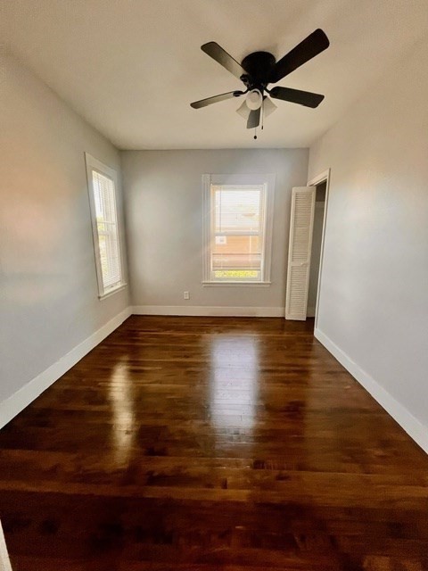 686 River Street, Unit 1 Boston, MA 02136 - Photo 7 of 11 a view of empty room with wooden floor and fan