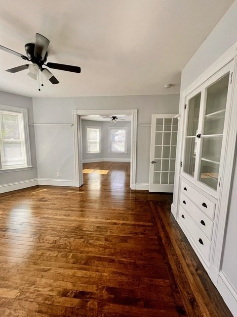686 River Street, Unit 1 Boston, MA 02136 - Photo 8 of 11 a view of an empty room with wooden floor and a window