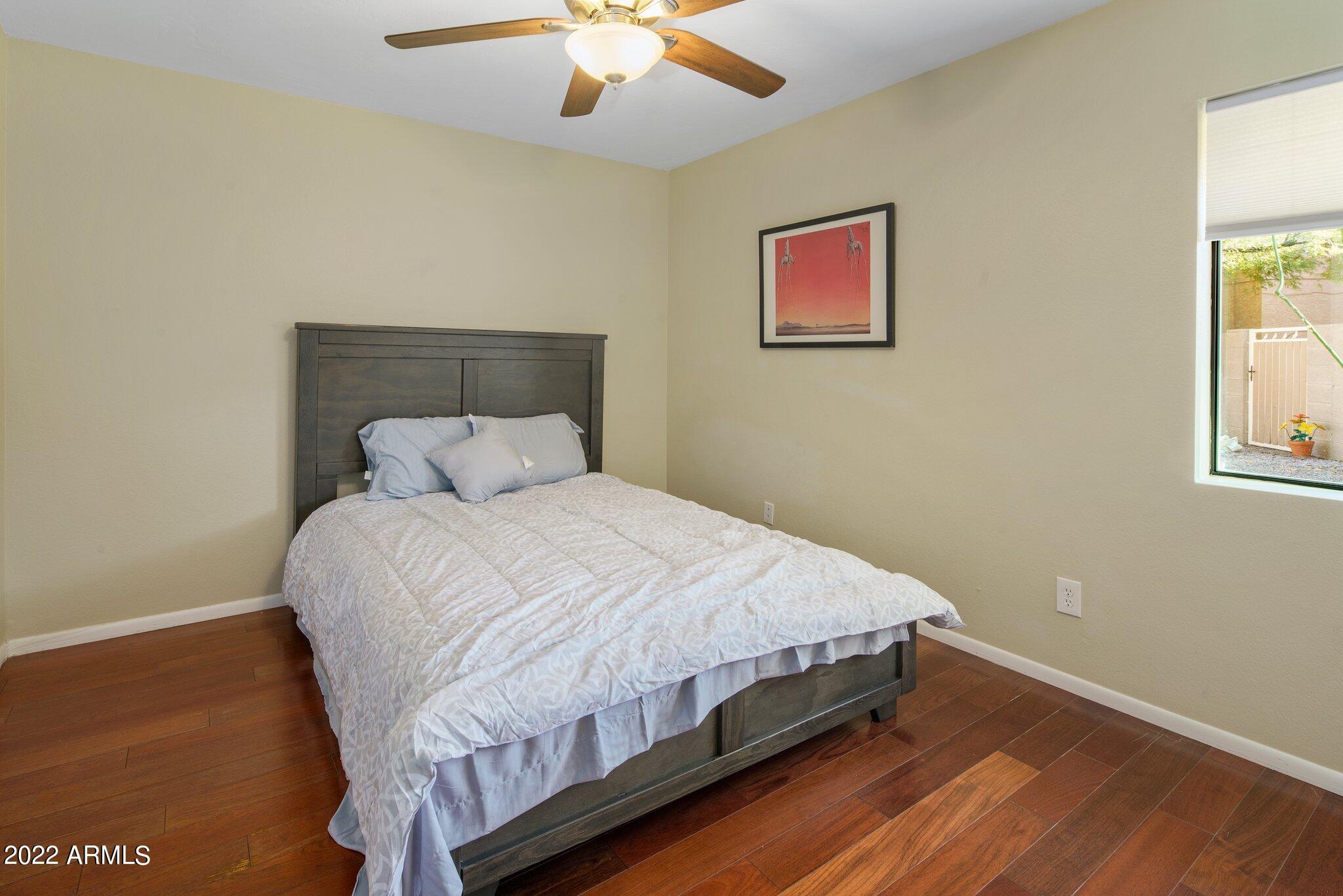 6609 East Phelps Road Scottsdale, AZ 85254 - Photo 62 of 83 a large bed sitting in a bedroom next to a window