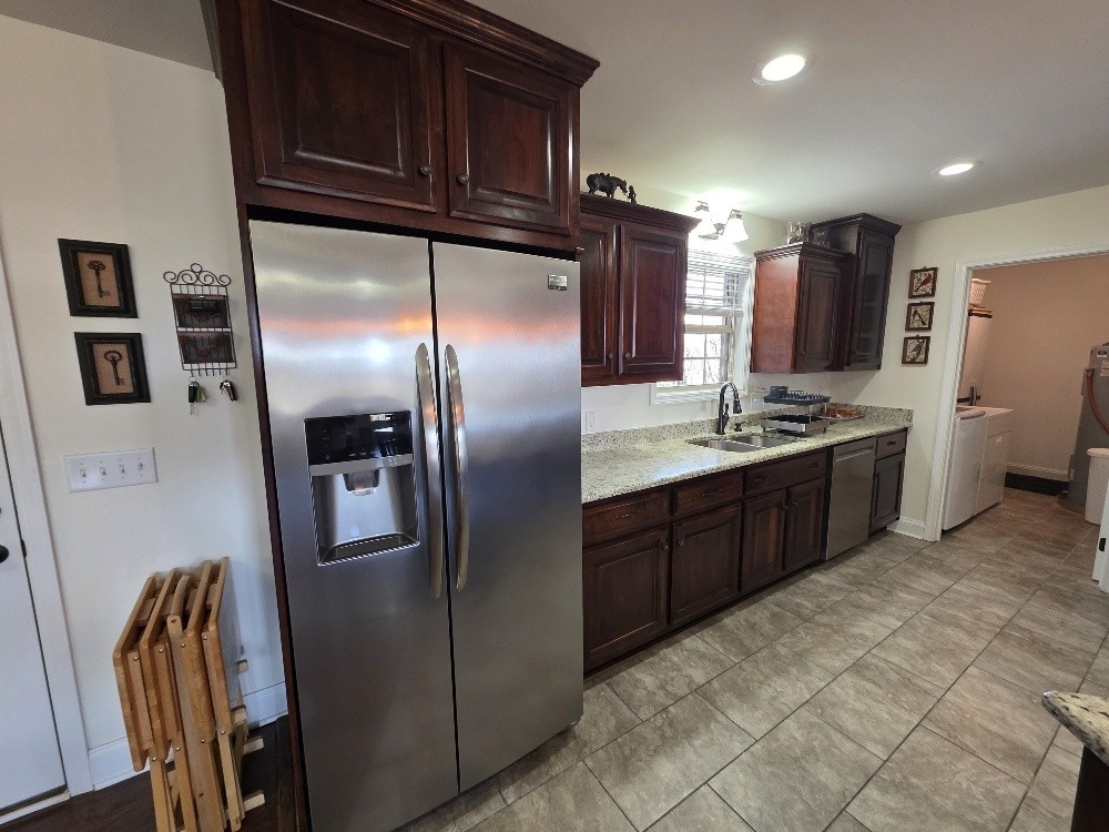 100 Ladybug Lane Bethpage, TN 37022 - Photo 11 of 56 a kitchen with stainless steel appliances granite countertop a refrigerator a stove and a sink