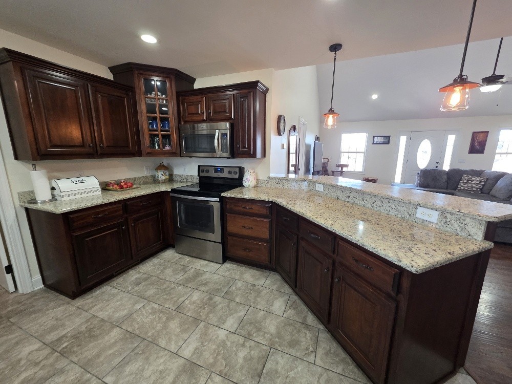 100 Ladybug Lane Bethpage, TN 37022 - Photo 14 of 56 a kitchen with a sink stove top oven and refrigerator