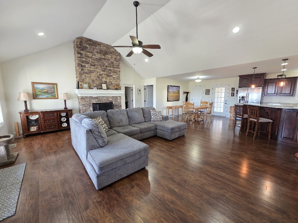 100 Ladybug Lane Bethpage, TN 37022 - Photo 15 of 56 a living room with furniture a fireplace and a chandelier