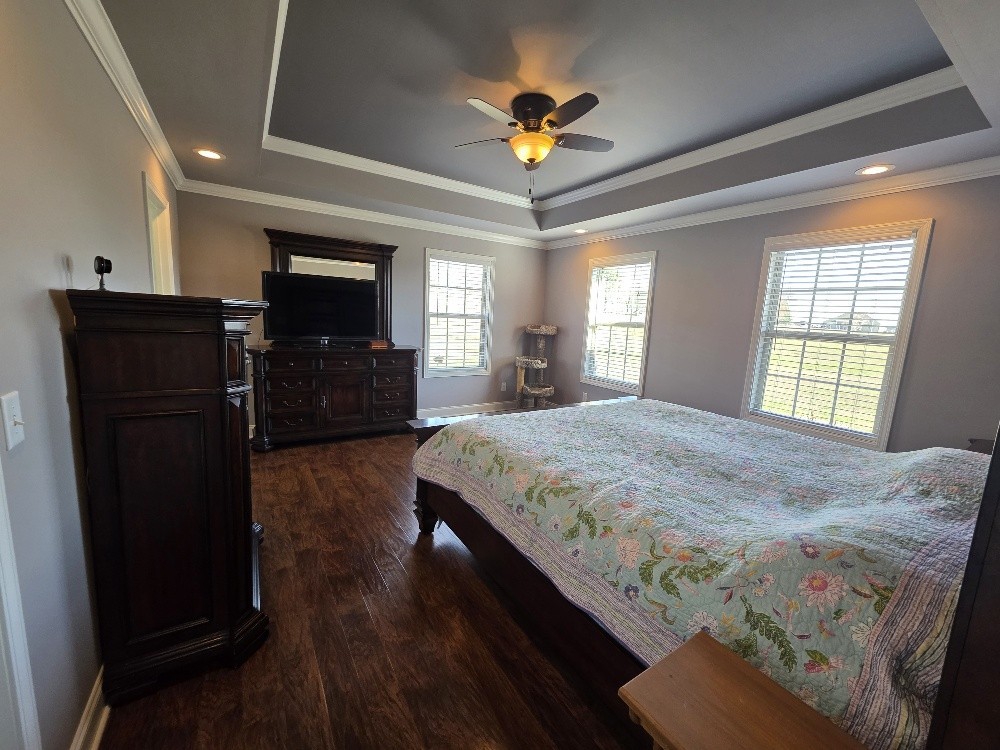 100 Ladybug Lane Bethpage, TN 37022 - Photo 19 of 56 a spacious bedroom with a bed and a flat screen tv