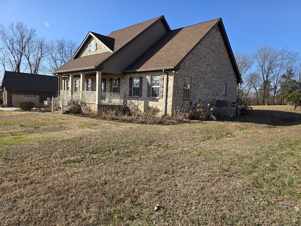 100 Ladybug Lane Bethpage, TN 37022 - Photo 6 of 56 a front view of a house with a yard and seating space
